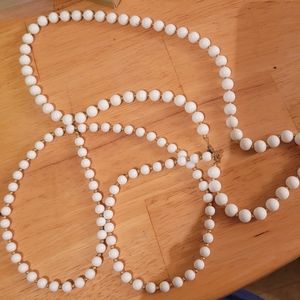 2 white beaded necklaces